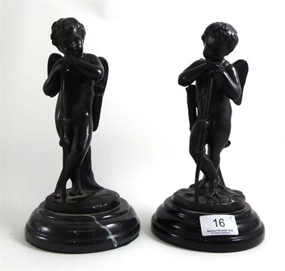 Lot 16 - A pair of bronze cherubs, 20th century, on marble plinth bases (2)
