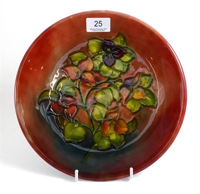 Lot 25 - A Walter Moorcroft Flambe Bourgainvillaea pattern plate, impressed factory marks and warrant label