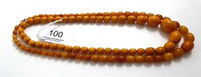 Lot 100 - A composite amber bead necklace and a simulated amber bead necklace