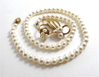 Lot 103 - A cultured pearl necklace, a ring, a brooch and a pair of earrings