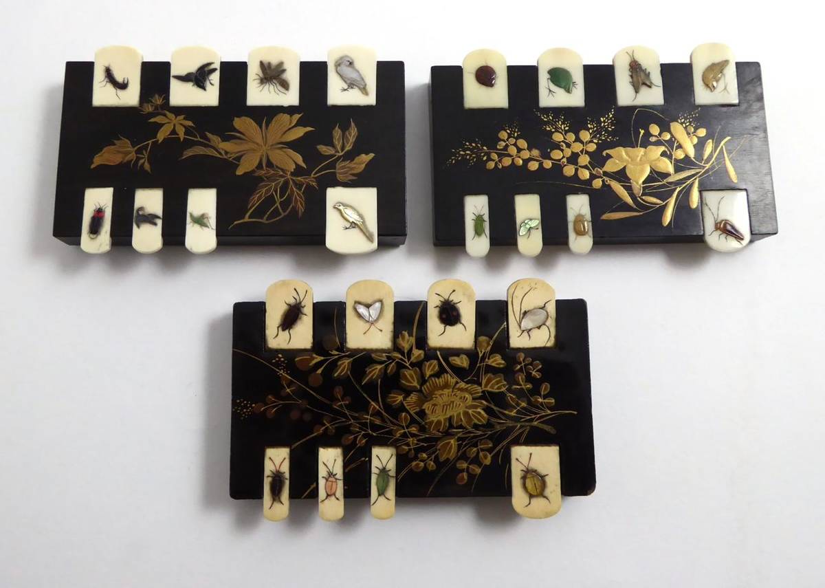 Lot 106 - A group of three ebonised game counters
