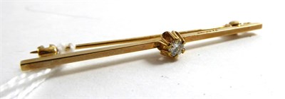 Lot 112 - A 9ct gold diamond set bar brooch