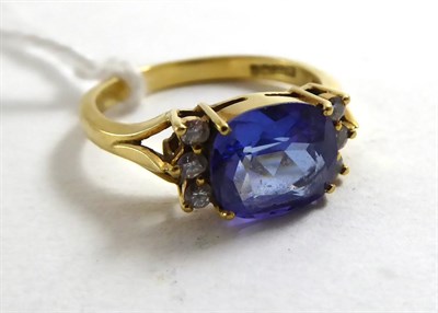 Lot 136 - An 18ct tanzanite and diamond ring, finger size N/12