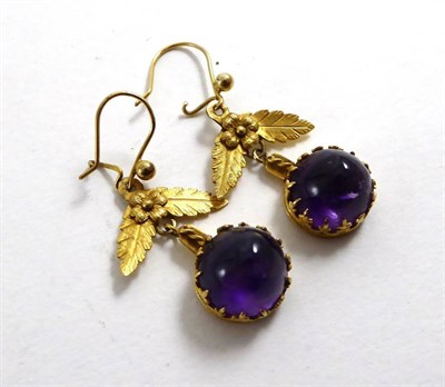 Lot 138 - A pair of amethyst cabochon earrings