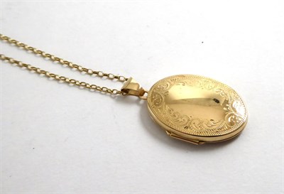 Lot 144 - A yellow metal locket on chain