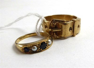 Lot 151 - A 9ct buckle ring and a 9ct gold sapphire and split pearl ring