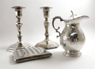 Lot 165 - A pair of loaded silver candlesticks, silver cigarette case and a plated jug
