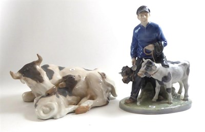 Lot 174 - Two Royal Copenhagen figures a herdsman and calves No. 1858 and a cow and calf No. 800