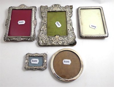 Lot 194 - Four various silver photograph frames and a white metal photograph frame (5)