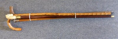 Lot 203 - A horse head walking stick, a silver topped cane and two others