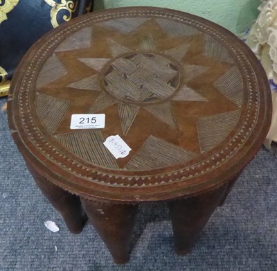 Lot 215 - A tribal stool