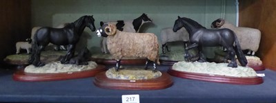 Lot 217 - J. Anne Butler animal figure groups comprising sheep, rams, horses and a Friesian cow (7)