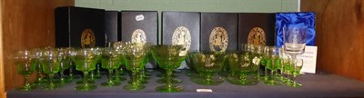 Lot 220 - Suite of green glassware and set of seven Theakston engraved glass goblets, original boxes