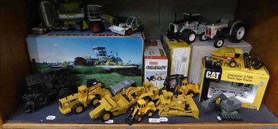 Lot 225 - A collection of Diecast and other model tractors and machinery including a Claas Cougar 1400, a...