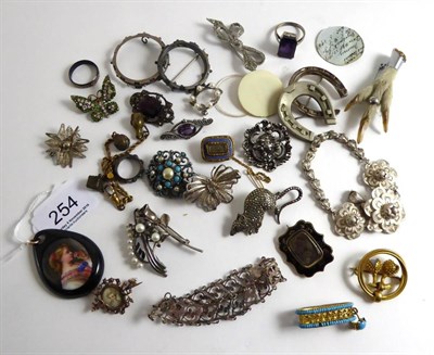 Lot 254 - Two Victorian mourning brooches, a paste set portrait miniature brooch, a ptarmigan claw...