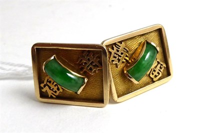 Lot 274 - A pair of Jade set Chinese character cufflinks stamped 14K