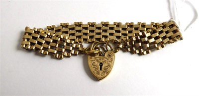 Lot 276 - A 9ct gold gate link bracelet with 9ct gold padlock clasp