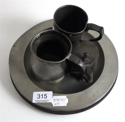 Lot 315 - Quantity of pewter comprising three 18th century plates, two tankards and a mustard (6)