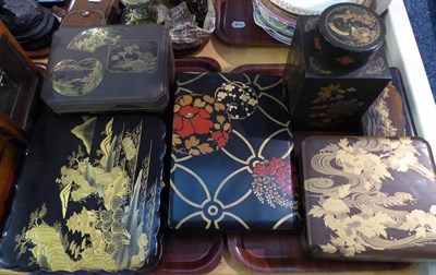 Lot 317 - A Japanese lacquer box and cover, Meiji/Taisho period, decorated in gilt with various shaped panels