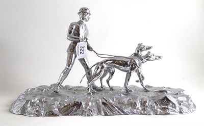 Lot 322 - Silver plated hare coursing figure group, signed Benton, 36cm diameter