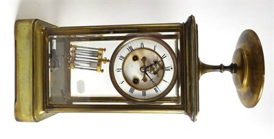 Lot 325 - A brass four glass striking mantel clock, circa 1890, bevelled glass panels, surmounted by a...