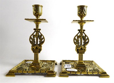 Lot 326 - A pair of Arts & Crafts brass candlesticks, stamped Townshend & Co