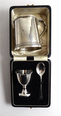 Lot 332 - A silver mug and a cased silver christening egg cup and spoon