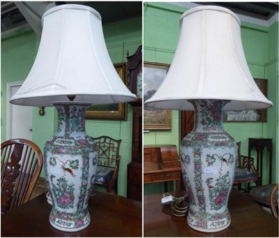 Lot 345 - A pair of Cantonese famille rose table lamps