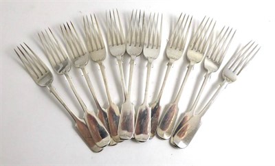 Lot 377 - A set of eleven silver dessert forks by Josiah Williams & Co., Exeter 1878 each engraved with a...