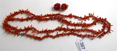 Lot 387 - A coral necklace and pair of coral clip earrings