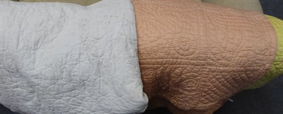 Lot 395 - Peach and yellow cotton reversible quilt, another in white with circular quilting (2)