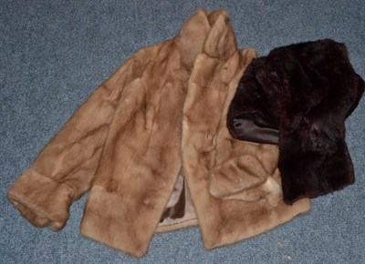 Lot 1040 - A Saga Mink light brown cropped jacket and a dark fur stole (2)