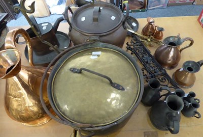 Lot 1114 - Copper and brass pans, copper and pewter measures, skillet, etc