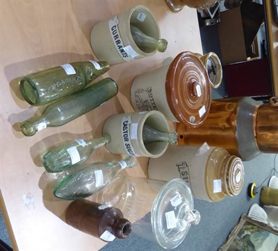 Lot 1116 - A Leith Creamery copper churn, a Dunmore's Biscuits glass jar, glass bottles, etc