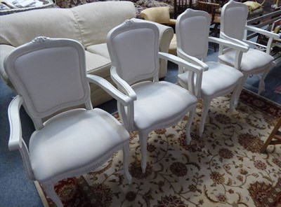 Lot 1131 - A set of four cream painted chairs