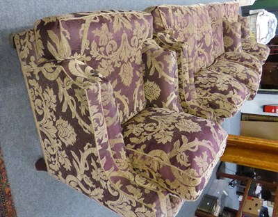 Lot 1142 - A modern three piece suite upholstered in violet