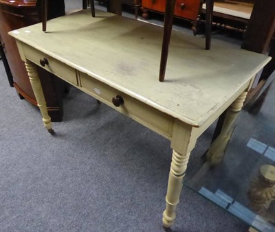 Lot 1157 - A painted pine farmhouse side table fitted with two drawers