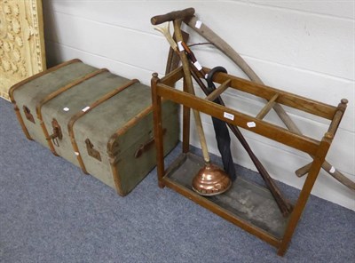 Lot 1164 - An oak stick stand, a scythe, two sticks, an umbrella, a posser and a trunk