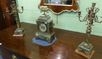 Lot 1248 - A green onyx and gilt metal mounted mantel clock with garniture, circa 1910, urn finial, scroll...