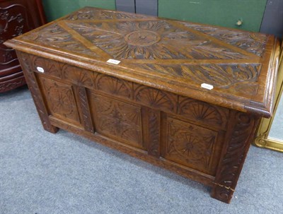 Lot 1252 - A carved oak coffer of small proportions