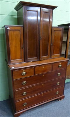 Lot 1258 - A 19th century mahogany cabinet on chest, the lower section a four height chest of drawers, the...