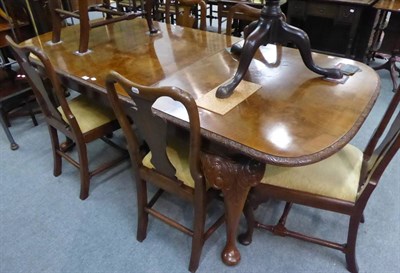 Lot 1272 - A Queen Anne style walnut dining table suite (table and six chairs)