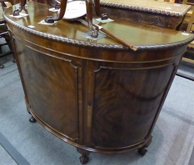 Lot 1276 - A figured mahogany reproduction D shaped cabinet