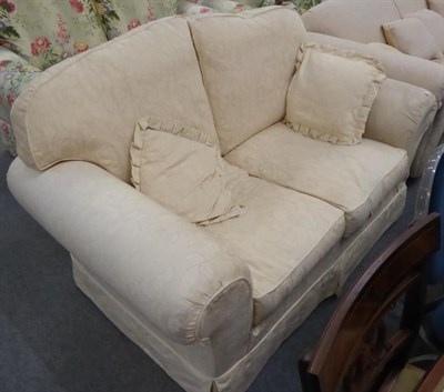 Lot 1297 - Cream two seater settee