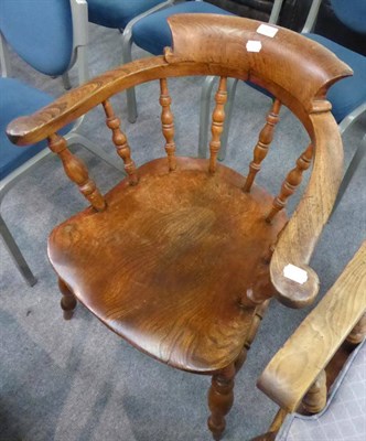 Lot 1309 - A 19th century oak and elm captain's chair