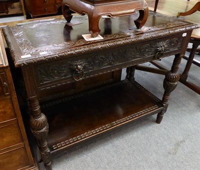 Lot 1318 - A carved oak buffet