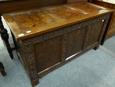 Lot 1322 - A 19th century carved and panelled oak coffer