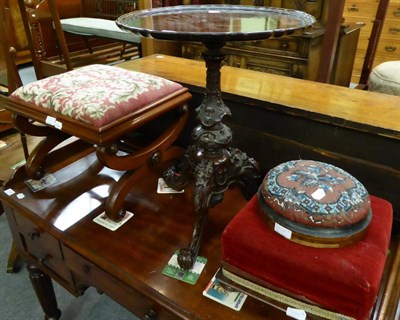 Lot 1328 - A 19th century carved tripod table together with three various stools