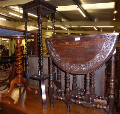 Lot 1340 - A Victorian mahogany occasional table with boldly turned standard, a carved oak drop leaf...