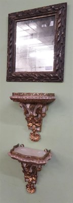 Lot 1351 - A pair of painted and gilt scrolling wall sconces with gilt metal to gallery, 29cm high and an 18th